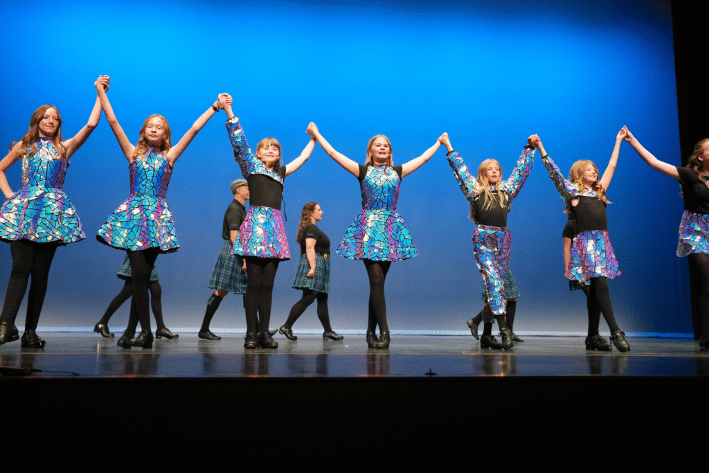 Dancers celebrating after performing their Irish dances.