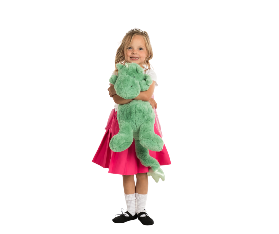 Young Irish dancer holding dragon stuffed animal at the ADC Irish Dance Studio.