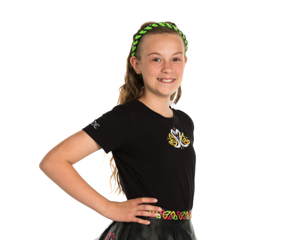 A teenage dancer posing after one of their irish dance lessons.