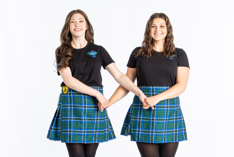 Irish dancing students posing together, representing friendship in ADC Irish Dance.